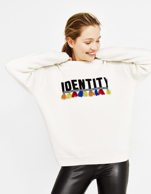 Oversized sweater with slogan